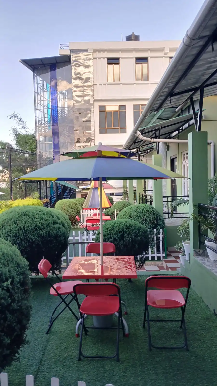 Front garden of the cottages with umbrella seating