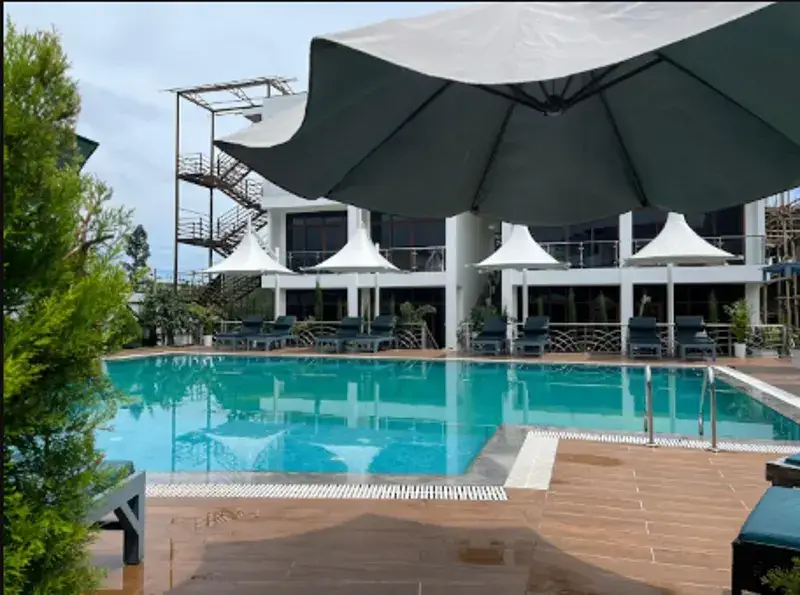 Poolside loungers and white parasols